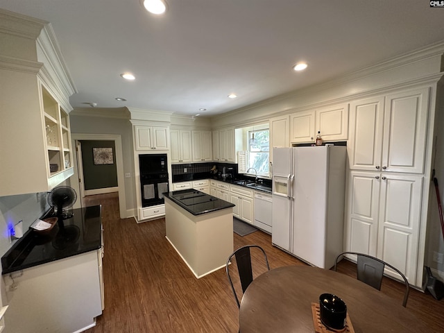 219 Mallet Hill Rd, Columbia, SC 29223 - kitchen with black appliances, dark countertops, a kitchen island, crown molding, and a sink