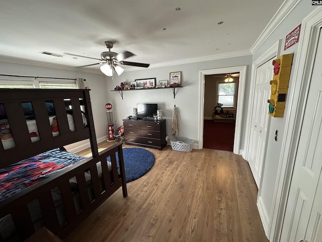 219 Mallet Hill Rd, Columbia, SC 29223 - bedroom with wood finished floors, ornamental molding, baseboards, and ceiling fan