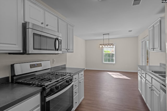 116 Harmon Creek Ct, Lexington, SC 29072 - kitchen with stainless steel appliances, dark wood-style flooring, white cabinets, and baseboards