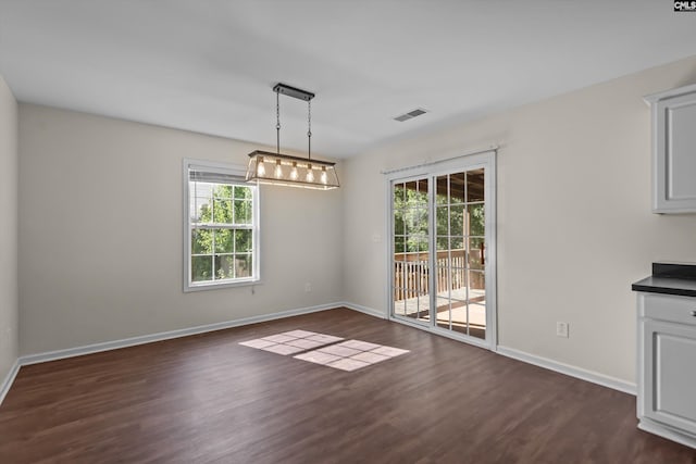 116 Harmon Creek Ct, Lexington, SC 29072 - unfurnished dining area featuring dark wood-style floors and baseboards