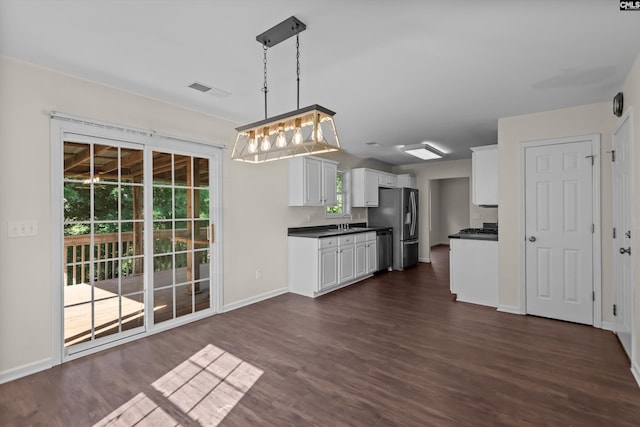 116 Harmon Creek Ct, Lexington, SC 29072 - kitchen featuring appliances with stainless steel finishes, dark countertops, a sink, white cabinetry, and dark wood-style flooring