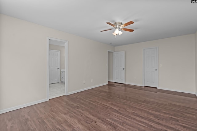 116 Harmon Creek Ct, Lexington, SC 29072 - unfurnished bedroom featuring wood finished floors, baseboards, ceiling fan, and ensuite bathroom