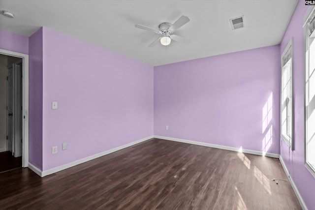 116 Harmon Creek Ct, Lexington, SC 29072 - empty room featuring plenty of natural light, a ceiling fan, dark wood-style floors, and baseboards