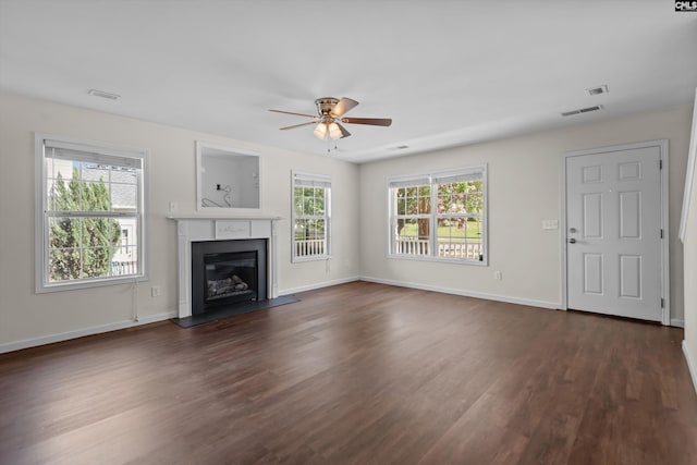 116 Harmon Creek Ct, Lexington, SC 29072 - unfurnished living room featuring a ceiling fan, dark wood-style flooring, a glass covered fireplace, and baseboards