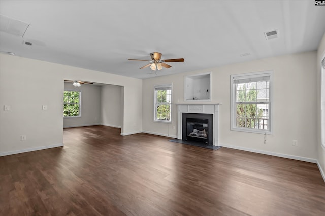 116 Harmon Creek Ct, Lexington, SC 29072 - unfurnished living room with a ceiling fan, dark wood-type flooring, baseboards, and a glass covered fireplace
