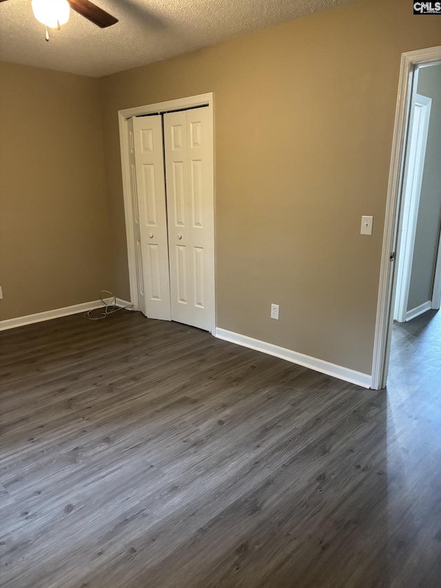 6 Bradley Ct Unit B, Cayce, SC 29033 - unfurnished bedroom featuring dark wood-type flooring, baseboards, a closet, and a ceiling fan