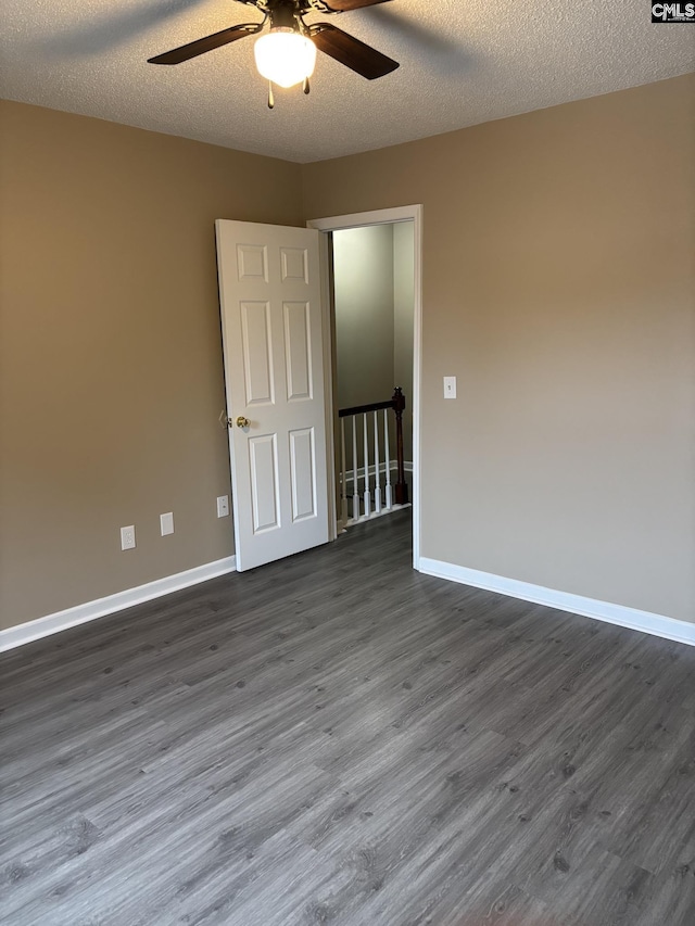 6 Bradley Ct Unit B, Cayce, SC 29033 - unfurnished room featuring a ceiling fan, dark wood-style floors, baseboards, and a textured ceiling