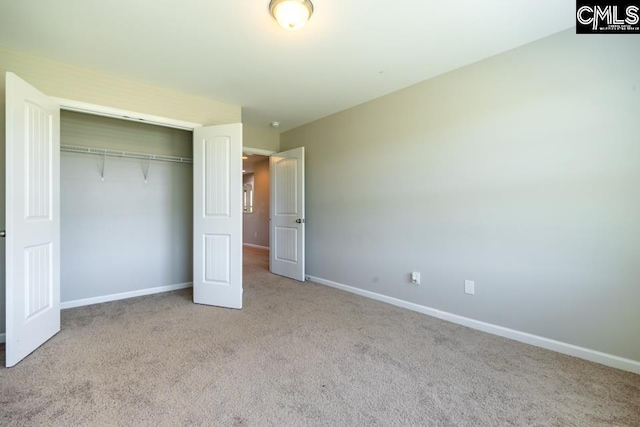 1811 Wildwood Ln, Elgin, SC 29045 - unfurnished bedroom featuring carpet flooring, baseboards, and a closet