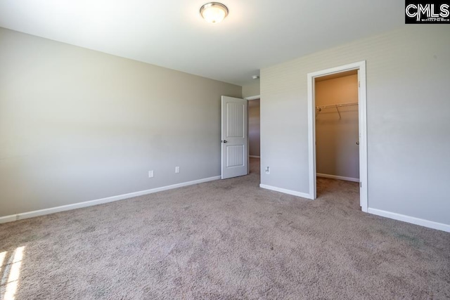 1811 Wildwood Ln, Elgin, SC 29045 - unfurnished bedroom featuring a spacious closet, carpet, baseboards, and a closet