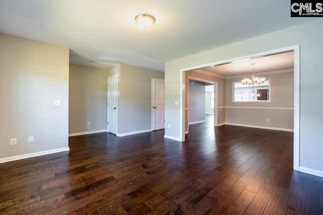 1811 Wildwood Ln, Elgin, SC 29045 - unfurnished room with a chandelier, dark wood-style flooring, baseboards, and ornamental molding
