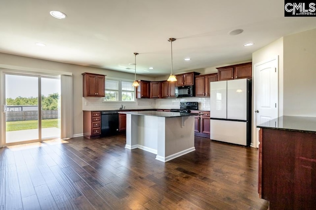 1811 Wildwood Ln, Elgin, SC 29045 - kitchen featuring black appliances, decorative backsplash, dark wood finished floors, and recessed lighting