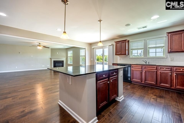 1811 Wildwood Ln, Elgin, SC 29045 - kitchen featuring dishwashing machine, dark brown cabinets, dark wood-style flooring, a ceiling fan, and recessed lighting