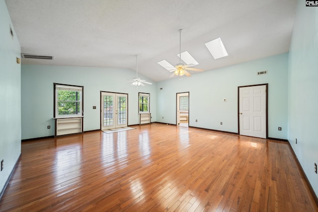 108 Commonwealth Ct, Lexington, SC 29073 - empty room with a skylight, a ceiling fan, hardwood / wood-style flooring, baseboards, and high vaulted ceiling