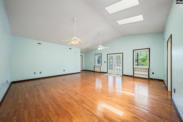 108 Commonwealth Ct, Lexington, SC 29073 - unfurnished living room featuring a skylight, light wood finished floors, vaulted ceiling, a ceiling fan, and baseboards