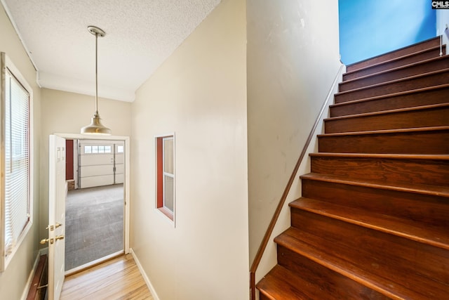 108 Commonwealth Ct, Lexington, SC 29073 - stairway featuring baseboards, wood finished floors, and a textured ceiling