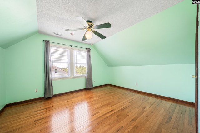 108 Commonwealth Ct, Lexington, SC 29073 - additional living space with vaulted ceiling, light wood finished floors, ceiling fan, baseboards, and a textured ceiling
