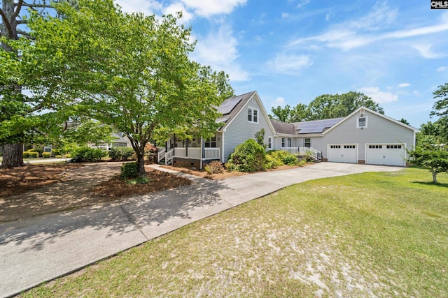 108 Commonwealth Ct, Lexington, SC 29073 - view of front of home with roof mounted solar panels, a front lawn, concrete driveway, covered porch, and an attached garage