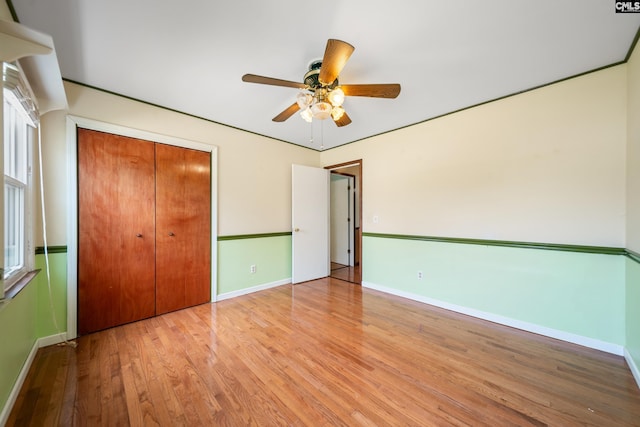 108 Commonwealth Ct, Lexington, SC 29073 - unfurnished bedroom featuring wood finished floors, a closet, baseboards, and ceiling fan