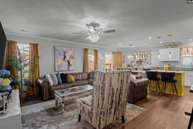 1020 Cameron Ridge Dr, Columbia, SC 29209 - living area featuring healthy amount of natural light, dark wood-style floors, a ceiling fan, crown molding, and recessed lighting