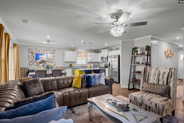 1020 Cameron Ridge Dr, Columbia, SC 29209 - living area with a ceiling fan, crown molding, recessed lighting, a chandelier, and wood finished floors