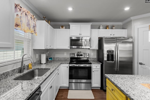 1020 Cameron Ridge Dr, Columbia, SC 29209 - kitchen featuring appliances with stainless steel finishes, a sink, white cabinetry, ornamental molding, and dark wood-type flooring