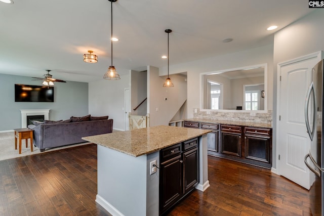 145 Decoy Ct, Sumter, SC 29145 - kitchen featuring freestanding refrigerator, dark wood finished floors, decorative backsplash, ceiling fan, and open floor plan
