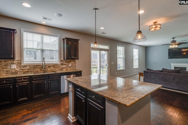145 Decoy Ct, Sumter, SC 29145 - kitchen with stainless steel dishwasher, a sink, backsplash, a ceiling fan, and recessed lighting