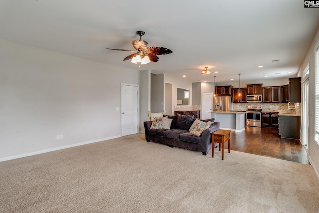 145 Decoy Ct, Sumter, SC 29145 - living room featuring dark carpet, recessed lighting, baseboards, ceiling fan, and healthy amount of natural light