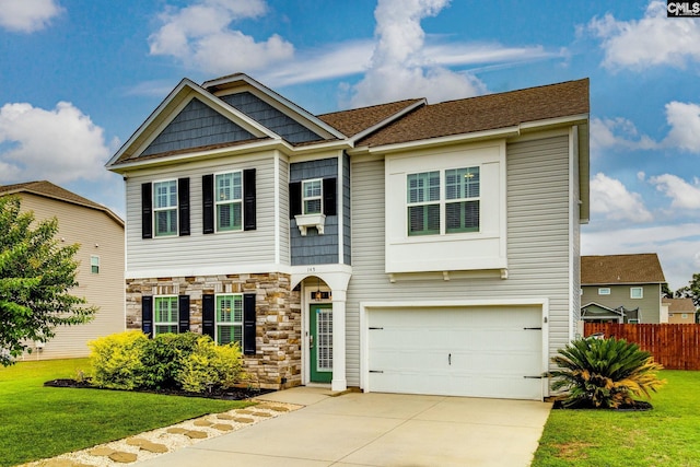 145 Decoy Ct, Sumter, SC 29145 - view of front of house featuring an attached garage, stone siding, and concrete driveway