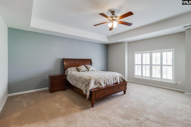 145 Decoy Ct, Sumter, SC 29145 - bedroom with a raised ceiling, light colored carpet, baseboards, and ceiling fan