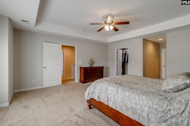 145 Decoy Ct, Sumter, SC 29145 - carpeted bedroom featuring a tray ceiling, baseboards, a spacious closet, a closet, and ceiling fan