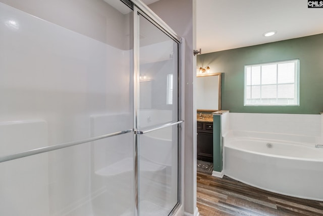 145 Decoy Ct, Sumter, SC 29145 - full bath with wood finished floors, vanity, a shower stall, a bath, and recessed lighting