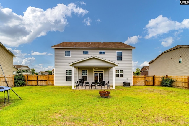 145 Decoy Ct, Sumter, SC 29145 - rear view of property featuring a fire pit, ceiling fan, a trampoline, a patio area, and central AC unit