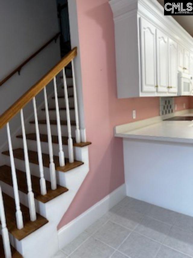 117 York Commons, Lexington, SC 29072 - stairs with baseboards and tile patterned floors