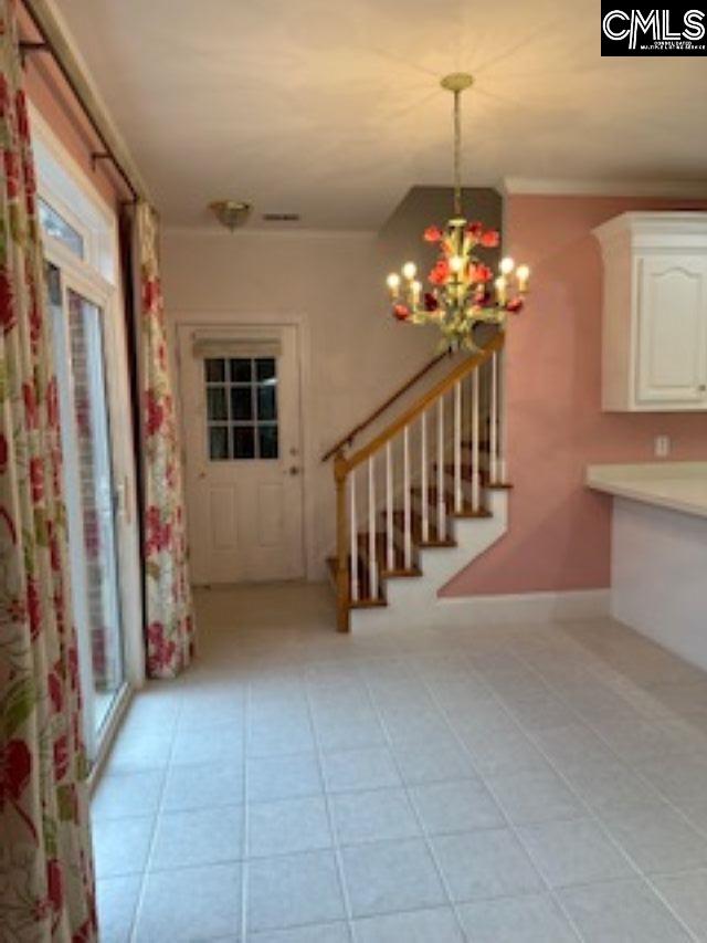 117 York Commons, Lexington, SC 29072 - entrance foyer featuring a chandelier, stairs, and baseboards