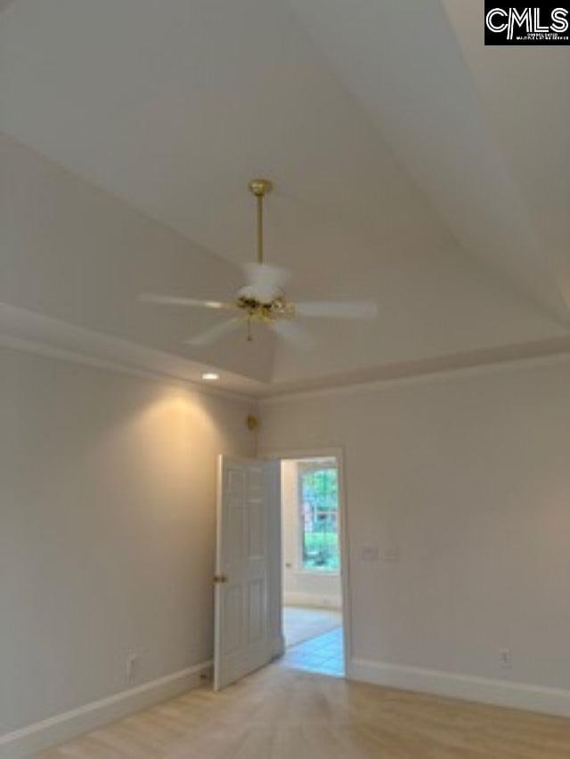 117 York Commons, Lexington, SC 29072 - spare room with ceiling fan, baseboards, light wood-style floors, and lofted ceiling