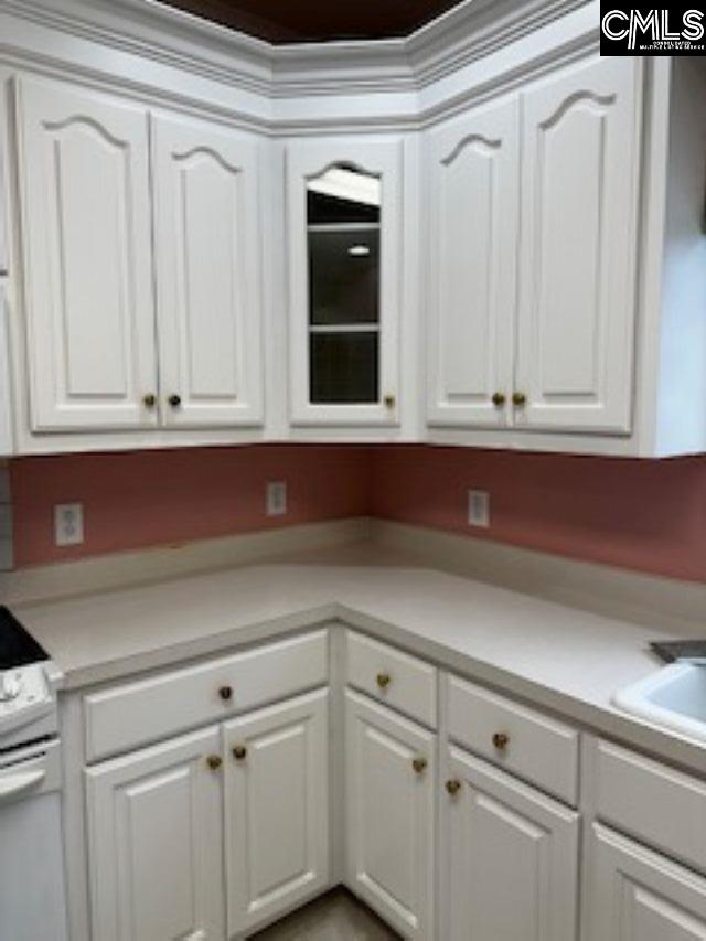 117 York Commons, Lexington, SC 29072 - kitchen featuring white range with electric cooktop, white cabinets, and light countertops