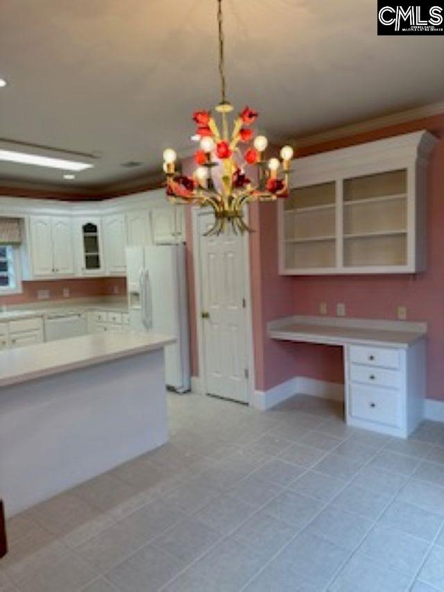 117 York Commons, Lexington, SC 29072 - kitchen with white appliances, open shelves, baseboards, crown molding, and white cabinets