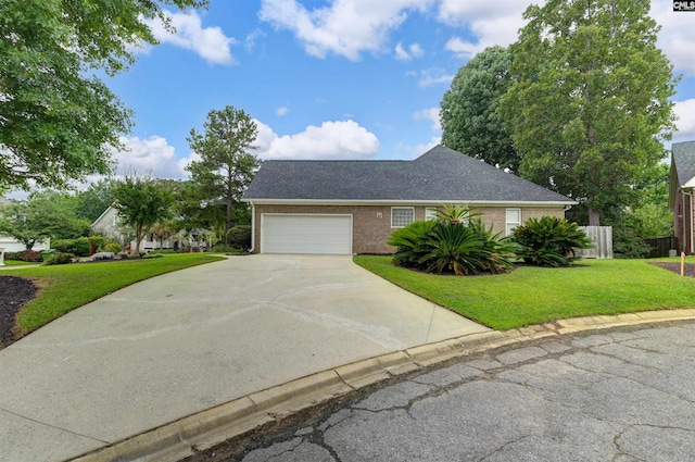 217 Tattlers Trl, Irmo, SC 29063 - view of front of house with driveway, brick siding, a garage, and roof with shingles