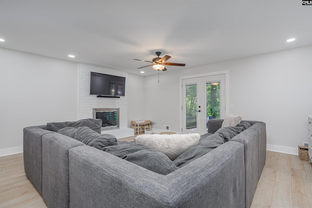 315 Bent Pine Dr, Columbia, SC 29212 - living room featuring a brick fireplace, ceiling fan, light wood-style floors, recessed lighting, and baseboards