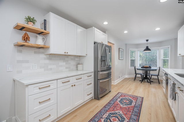 315 Bent Pine Dr, Columbia, SC 29212 - kitchen with stainless steel fridge with ice dispenser, light wood-style flooring, white cabinets, tasteful backsplash, and open shelves