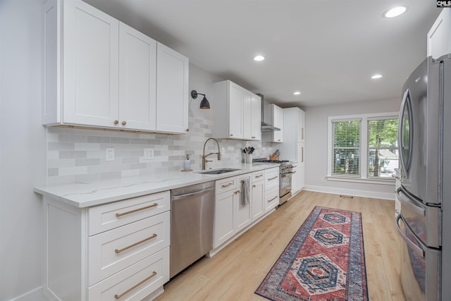 315 Bent Pine Dr, Columbia, SC 29212 - kitchen featuring appliances with stainless steel finishes, a sink, light wood-style floors, white cabinetry, and recessed lighting