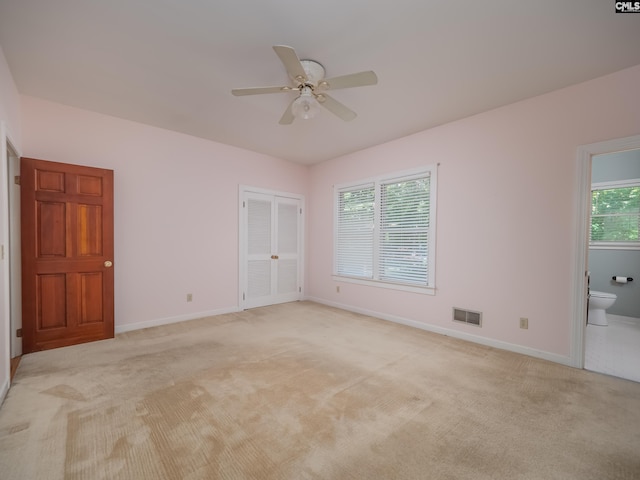 117 Falmouth Rise Rd, Columbia, SC 29229 - unfurnished bedroom with light colored carpet, baseboards, ensuite bath, and a ceiling fan
