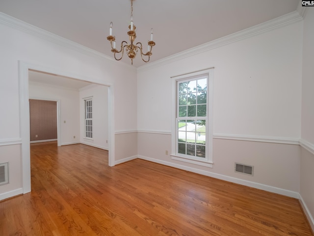 117 Falmouth Rise Rd, Columbia, SC 29229 - unfurnished room with a chandelier, baseboards, light wood-type flooring, and crown molding