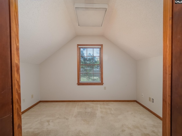 117 Falmouth Rise Rd, Columbia, SC 29229 - bonus room featuring light colored carpet, a textured ceiling, vaulted ceiling, and baseboards