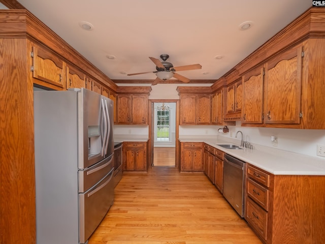117 Falmouth Rise Rd, Columbia, SC 29229 - kitchen featuring stainless steel appliances, a sink, brown cabinets, light wood-style flooring, and a ceiling fan