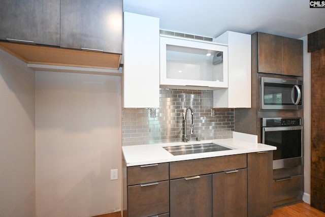 2110 Bouknight St, Newberry, SC 29108 - kitchen with stainless steel appliances, a sink, modern cabinets, and light countertops