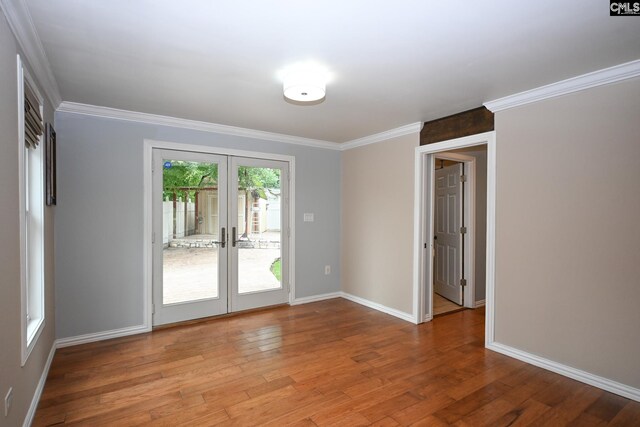 2110 Bouknight St, Newberry, SC 29108 - spare room with french doors, wood finished floors, baseboards, and ornamental molding