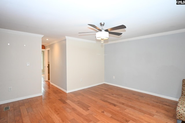 2110 Bouknight St, Newberry, SC 29108 - spare room featuring a ceiling fan, light wood-style flooring, crown molding, and baseboards