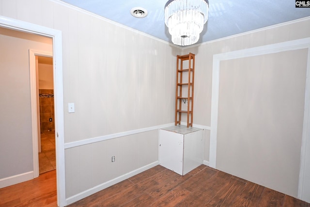 2110 Bouknight St, Newberry, SC 29108 - spare room featuring a chandelier, wood finished floors, and crown molding